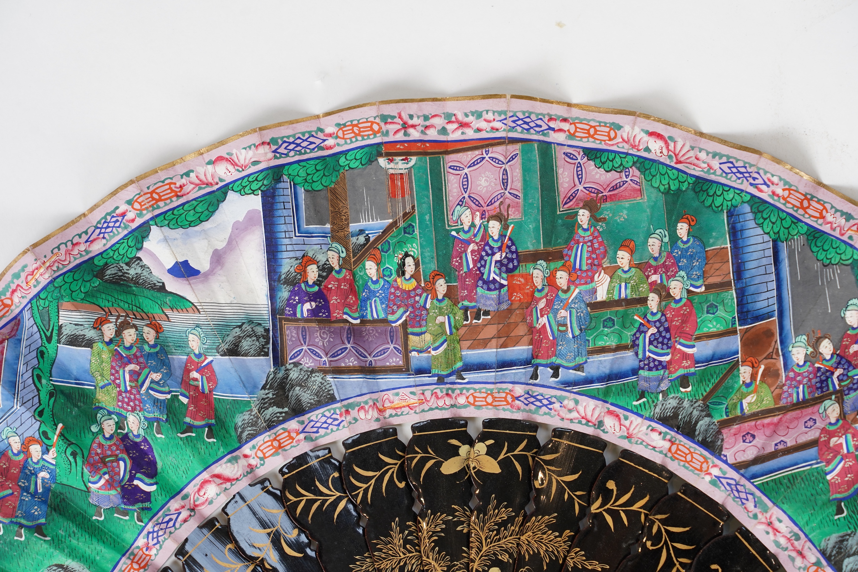 Three Chinese gilt-decorated black lacquer and painted leaf fans, 19th century